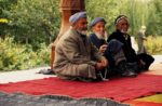 Friends meeting outside a mosque in Panjakent. Photo credit: Michel Behar
