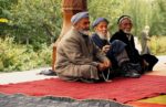 Friends meeting outside a mosque in Penjikent, Tajikistan. Photo credit: Michel Behar