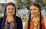 The caps worn by these Turkmen girls indicate they are unmarried. Photo credit: Ana Filonov