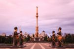 Ashgabat’s Independence Park, clad in characteristic gold and white marble, is lined with massive statues of Turkmen heroes. Photo credit: Lindsay Fincher