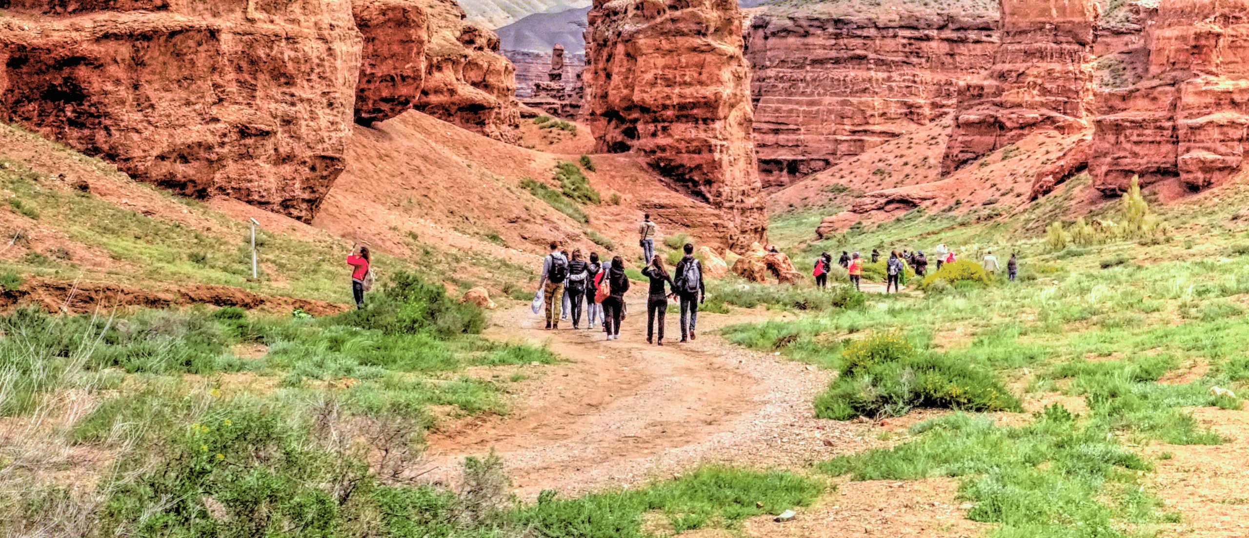 A group of people hike in Charyn Canyon, Kazakhstan